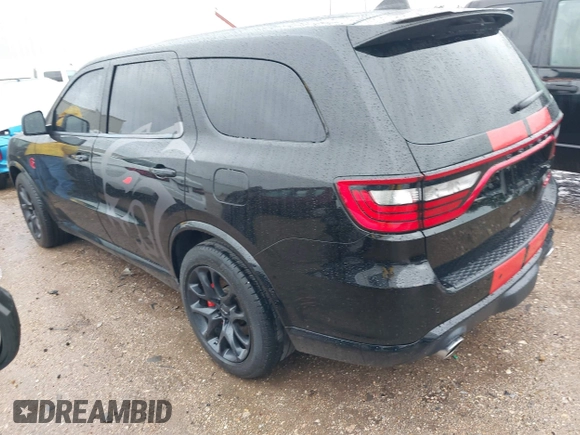 2023 Dodge Durango SRT Hellcat Premium with VIN 1C4SDJH99PC584770, listed as a IAAI auction lot 41562157 with 14,598 mi miles and . Bid and sale history available at DreamBid. Image 3.