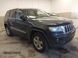 2012 Jeep Grand Cherokee Laredo with VIN 1C4RJFAG5CC351539, listed as a IAAI auction lot 41861533 with 166,909 mi miles. Bid and sale history available at carsss.com. Image 1.