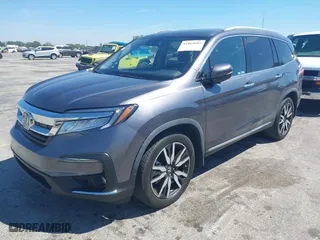 2020 Honda Pilot Touring 8-Passenger with VIN 5FNYF5H90LB000801, listed as a IAAI auction lot 41865605 with 62,743 mi miles. Bid and sale history available at carsss.com. Image 17.