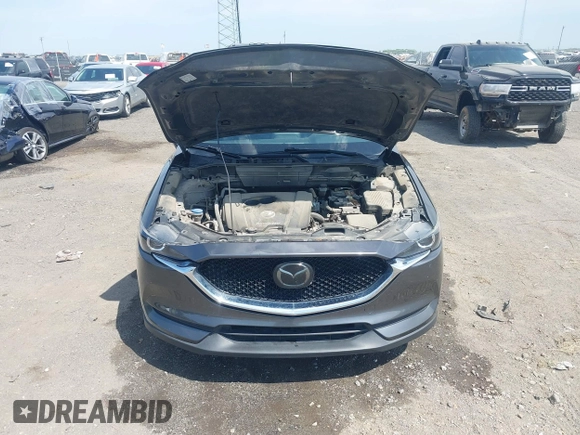 2018 Mazda CX-5 Touring with VIN JM3KFACM9J1348054, listed as a IAAI auction lot 42043458 with 120,177 mi miles. Bid and sale history available at carsss.com. Image 10.
