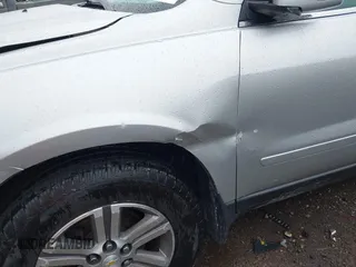 2016 Chevrolet Traverse LT z VIN 1GNKRHKDXGJ115343, wystawiony jako IAAI lot #42246084 z przebiegiem 148 021 mil mil oraz . Historia ofert i sprzedaży dostępna na DreamBid. Obrazek 17.