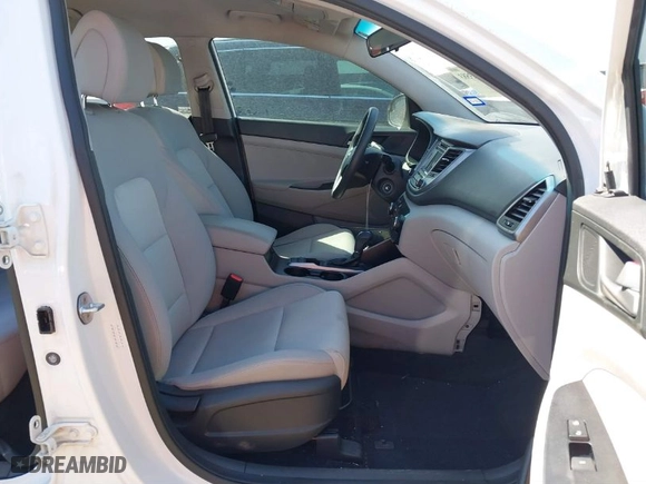 2018 Hyundai Tucson SE with VIN KM8J23A40JU669361, listed as a IAAI auction lot 41633583 with 97,884 mi miles. Bid and sale history available at carsss.com. Image 5.
