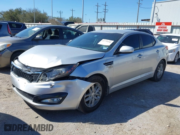 2013 Kia Optima LX z VIN KNAGM4A70D5414844, wystawiony jako IAAI lot #41774246 z przebiegiem 180 332 mil mil oraz . Historia ofert i sprzedaży dostępna na DreamBid. Obrazek 2.