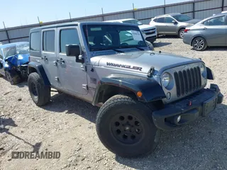 2015 Jeep Wrangler Unlimited Sport z VIN 1C4BJWDG0FL745533, wystawiony jako IAAI lot #41844126 z przebiegiem 151 620 mil mil oraz . Historia ofert i sprzedaży dostępna na DreamBid. Obrazek 1.