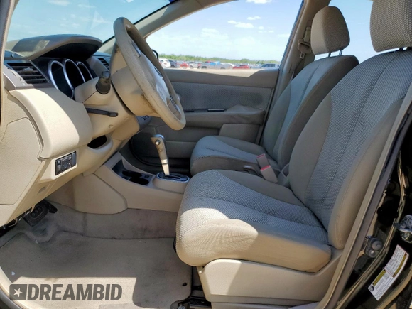 2009 Nissan Versa SL with VIN 3N1BC13E69L383863, listed as a Copart auction lot 59166235 with 138,630 mi miles and Salvage title. Bid and sale history available at DreamBid. Image 7.