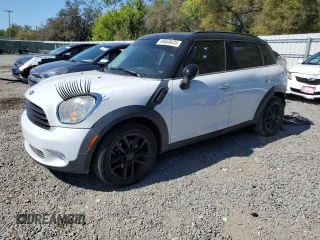 2011 MINI Countryman with VIN WMWZB3C56BWM00040, listed as a Copart auction lot 48660435 with 146,607 mi miles and Salvage Title. Bid and sale history available at DreamBid. Image 1.