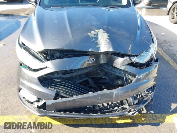 2018 Ford Fusion SE z VIN 3FA6P0H70JR191384, wystawiony jako IAAI lot #41340319 z przebiegiem 89 581 mil mil oraz . Historia ofert i sprzedaży dostępna na DreamBid. Obrazek 6.