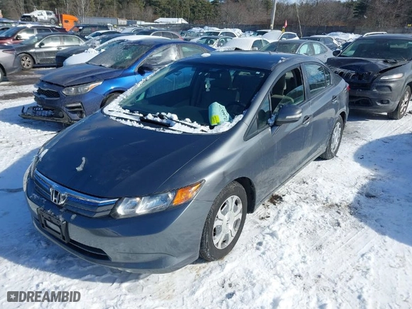 2012 Honda Civic Hybrid with VIN JHMFB4F35CS003299, listed as a IAAI auction lot 41509713 with 144,024 mi miles. Bid and sale history available at carsss.com. Image 2.