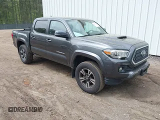2019 Toyota Tacoma SR z VIN 3TMCZ5AN7KM198876, wystawiony jako IAAI lot #42101858 z przebiegiem 118 367 mil mil oraz . Historia ofert i sprzedaży dostępna na DreamBid. Obrazek 1.