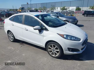 2019 Ford Fiesta SE z VIN 3FADP4BJ6KM143891, wystawiony jako IAAI lot #42244796 z przebiegiem 62 143 mil mil oraz . Historia ofert i sprzedaży dostępna na DreamBid. Obrazek 1.