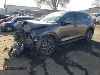 2018 Mazda CX-5 Grand Touring with VIN JM3KFADMXJ1323646, listed as a Copart auction lot 46857825 with 62,262 mi miles and Salvage title. Bid and sale history available at DreamBid. Image 1.