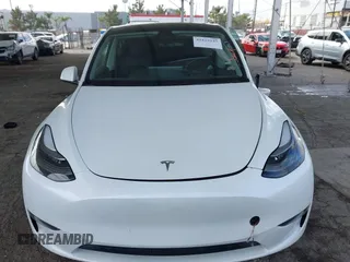 2023 Tesla Model Y Long Range with VIN 7SAYGAEE7PF607195, listed as a IAAI auction lot 41819147 with 74,694 mi miles. Bid and sale history available at carsss.com. Image 12.