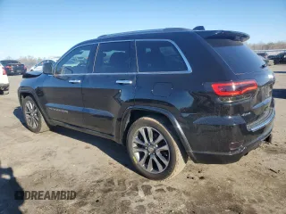 2017 Jeep Grand Cherokee Overland with VIN 1C4RJFCT7HC684746, listed as a Copart auction lot 83259314 with 106,848 mi miles and Salvage Title. Bid and sale history available at carsss.com. Image 2.