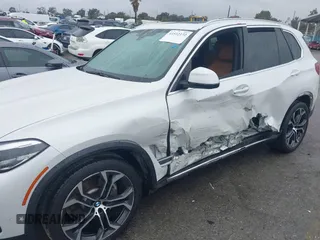 2021 BMW X5 sDrive40i with VIN 5UXCR4C03M9F24817, listed as a IAAI auction lot 41512172 with 54,867 mi miles. Bid and sale history available at carsss.com. Image 6.