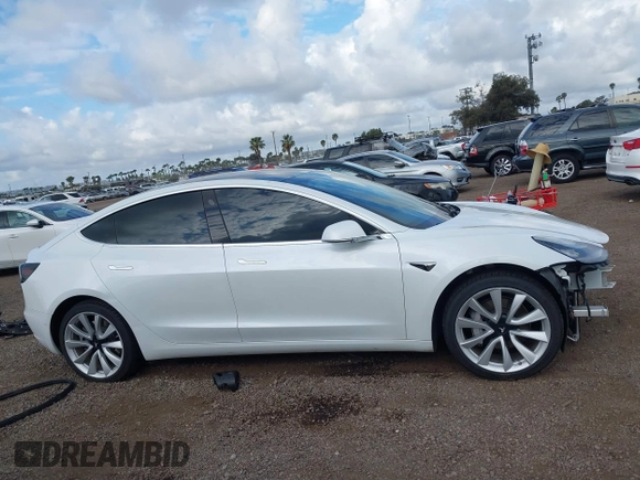 2019 Tesla Model 3 Long Range with VIN 5YJ3E1EBXKF512710, listed as a IAAI auction lot 42063737 with 90,721 mi miles and . Bid and sale history available at DreamBid. Image 14.