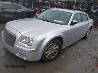 2010 Chrysler 300 C Hemi with VIN 2C3CA6CT5AH141439, listed as a IAAI auction lot 40797974 with 213,843 mi miles and . Bid and sale history available at carsss.com. Image 2.
