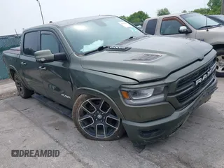 2020 Ram 1500 Laramie with VIN 1C6SRFJTXLN181021, listed as a IAAI auction lot 42483935 with 75,238 mi miles and . Bid and sale history available at DreamBid. Image 1.
