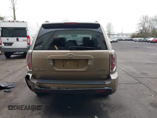 2006 Honda Pilot EX-L with VIN 2HKYF18516H528116, listed as a IAAI auction lot 41782324 with 245,280 mi miles and . Bid and sale history available at DreamBid. Image 16.