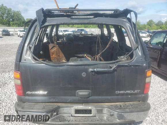 2003 Chevrolet Tahoe LS z VIN 1GNEC13Z03J273863, wystawiony jako Copart lot #56574255 z przebiegiem Nie podano mil oraz Szkoda całkowita • Salvage title. Historia ofert i sprzedaży dostępna na DreamBid. Obrazek 6.