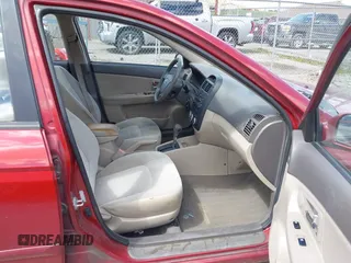 2009 Kia Spectra EX with VIN KNAFE221495665378, listed as a IAAI auction lot 42036945 with 153,254 mi miles. Bid and sale history available at carsss.com. Image 5.