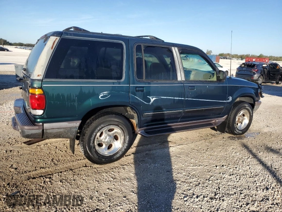1997 Ford Explorer XL with VIN 1FMDU34E5VZB40878, listed as a Copart auction lot 84009744 with 185,047 mi miles and Salvage title. Bid and sale history available at DreamBid. Image 3.