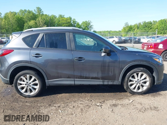 2014 Mazda CX-5 Grand Touring with VIN JM3KE4DY2E0312952, listed as a IAAI auction lot 42138721 with 99,993 mi miles and . Bid and sale history available at DreamBid. Image 13.