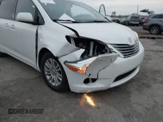 2015 Toyota Sienna XLE with VIN 5TDYK3DC9FS595827, listed as a IAAI auction lot 41014820 with 119,143 mi miles. Bid and sale history available at carsss.com. Image 6.