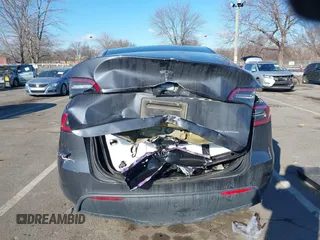 2020 Tesla Model Y Long Range with VIN 5YJYGDEE4LF030103, listed as a IAAI auction lot 41328929 with 64,896 mi miles and . Bid and sale history available at DreamBid. Image 16.