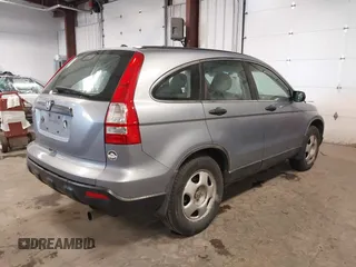 2009 Honda CR-V LX with VIN JHLRE48359C018488, listed as a IAAI auction lot 41824887 with 203,235 mi miles. Bid and sale history available at carsss.com. Image 4.