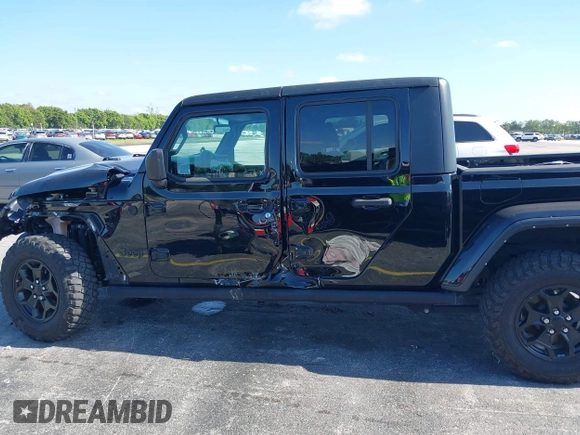 2021 Jeep Gladiator Willys with VIN 1C6HJTAGXML613431, listed as a IAAI auction lot 42180502 with 64,572 mi miles and . Bid and sale history available at DreamBid. Image 14.