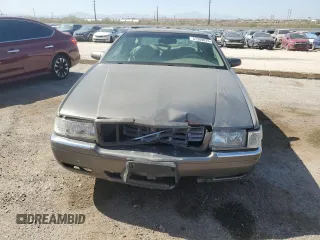 1998 Cadillac Eldorado z VIN 1G6EL12YXWU610918, wystawiony jako Copart lot #57309075 z przebiegiem 168 228 mil mil oraz Szkoda całkowita • Salvage title. Historia ofert i sprzedaży dostępna na DreamBid. Obrazek 5.