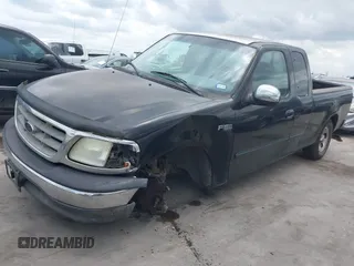 2002 Ford F-150 XL with VIN 1FTRX17202NA21470, listed as a IAAI auction lot 42098554 with 149,840 mi miles. Bid and sale history available at carsss.com. Image 2.