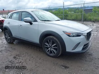 2017 Mazda CX-3 Touring z VIN JM1DKFC7XH0141919, wystawiony jako IAAI lot #42333679 z przebiegiem 93 234 mil mil oraz . Historia ofert i sprzedaży dostępna na DreamBid. Obrazek 1.