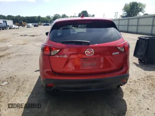 2016 Mazda CX-5 Grand Touring z VIN JM3KE2DY0G0722334, wystawiony jako Copart lot #59998185 z przebiegiem 51 449 mil mil oraz Szkoda całkowita • Salvage title. Historia ofert i sprzedaży dostępna na DreamBid. Obrazek 6.