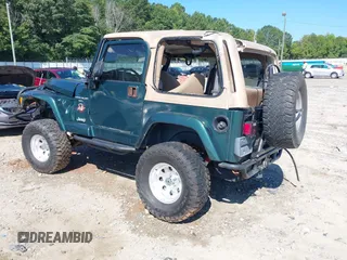 2001 Jeep Wrangler Sahara with VIN 1J4FA59S71P340368, listed as a IAAI auction lot 40148603 with 138,710 mi miles. Bid and sale history available at carsss.com. Image 3.