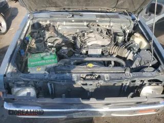 1993 Nissan Frontier SE z VIN 1N6HD16Y9PC398809, wystawiony jako Copart lot #70628754 z przebiegiem 224 511 mil mil oraz Szkoda całkowita • Salvage title. Historia ofert i sprzedaży dostępna na DreamBid. Obrazek 11.