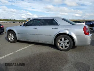 2006 Chrysler 300 C with VIN 2C3KK63H46H296625, listed as a Copart auction lot 70220974 with 104,811 mi miles and Salvage Title. Bid and sale history available at carsss.com. Image 2.