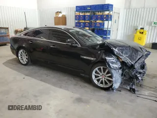 2014 Jaguar XJ with VIN SAJWA1CZ0E8V61168, listed as a Copart auction lot 54383215 with 137,724 mi miles and Salvage Title. Bid and sale history available at DreamBid. Image 4.