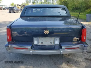 1988 Cadillac Eldorado z VIN 1G6EL1155JU600524, wystawiony jako Copart lot #59505125 z przebiegiem 110 972 mil mil oraz Szkoda całkowita • Salvage title. Historia ofert i sprzedaży dostępna na DreamBid. Obrazek 6.
