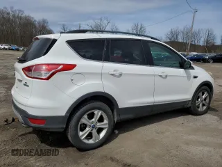 2014 Ford Escape SE with VIN 1FMCU0GX4EUB83323, listed as a Copart auction lot 51775125 with 129,437 mi miles and Salvage Title. Bid and sale history available at DreamBid. Image 3.