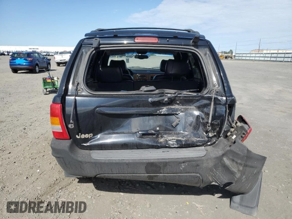 1999 Jeep Grand Cherokee Limited with VIN 1J4GW68N4XC679841, listed as a Copart auction lot 59760015 with 155,366 mi miles and Salvage title. Bid and sale history available at DreamBid. Image 6.