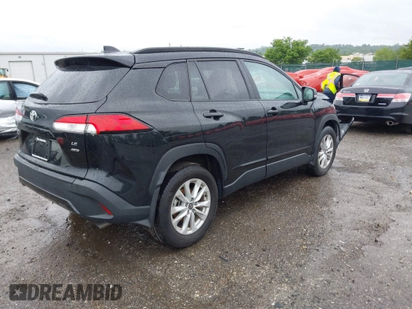 2022 Toyota Corolla Cross LE with VIN 7MUCAABG8NV004527, listed as a IAAI auction lot 42259519 with 15,211 mi miles and . Bid and sale history available at DreamBid. Image 4.
