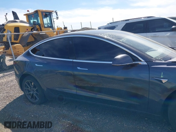 2019 Tesla Model 3 Mid Range with VIN 5YJ3E1EA5KF327679, listed as a IAAI auction lot 41804379 with 87,208 mi miles and . Bid and sale history available at DreamBid. Image 13.