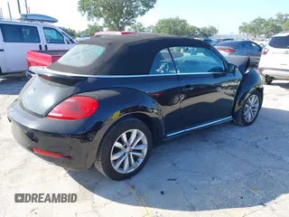 2015 Volkswagen Beetle with VIN 3VW5A7AT7FM811978, listed as a IAAI auction lot 41983986 with 84,421 mi miles and . Bid and sale history available at DreamBid. Image 4.