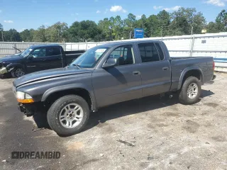 2003 Dodge Dakota Sport with VIN 1D7HL38N43S184708, listed as a Copart auction lot 73320964 with 143,398 mi miles and Salvage Title. Bid and sale history available at carsss.com. Image 1.