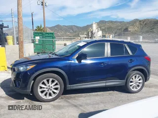 2014 Mazda CX-5 Grand Touring with VIN JM3KE2DY7E0376389, listed as a IAAI auction lot 42014946 with 126,081 mi miles. Bid and sale history available at carsss.com. Image 14.