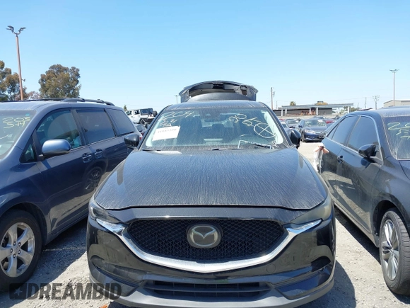 2018 Mazda CX-5 Grand Touring with VIN JM3KFADM4J0326760, listed as a IAAI auction lot 41885100 with 82,091 mi miles and . Bid and sale history available at DreamBid. Image 12.