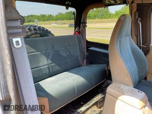 1999 Jeep Wrangler Sahara with VIN 1J4FY49S5XP496486, listed as a Copart auction lot 54989365 with 128,498 mi miles and Clean Title. Bid and sale history available at carsss.com. Image 6.