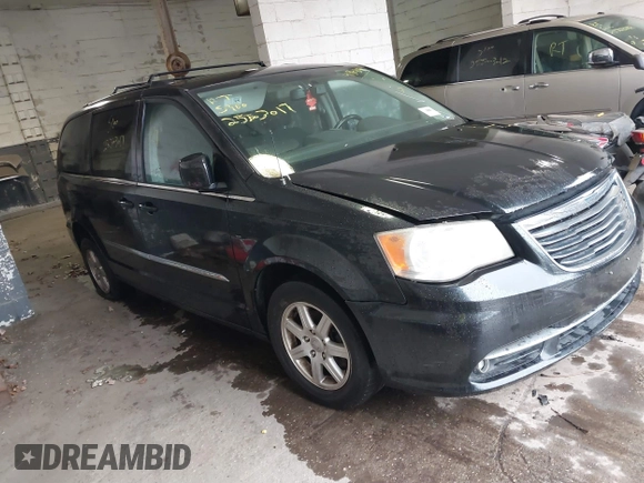 2011 Chrysler Town & Country Touring with VIN 2A4RR5DGXBR745293, listed as a IAAI auction lot 41862089 with 999,999 mi miles. Bid and sale history available at carsss.com. Image 1.