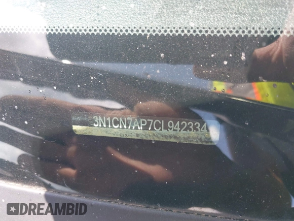 2012 Nissan Versa S z VIN 3N1CN7AP7CL942334, wystawiony jako IAAI lot #42744514 z przebiegiem 157 841 mil mil oraz . Historia ofert i sprzedaży dostępna na DreamBid. Obrazek 9.